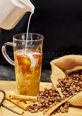 Buy stock photo Shot of coffee beans and a cup of cinnamon and vanilla coffee