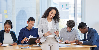 Buy stock photo Woman, office and smile with tablet for research or teamwork and collaboration. Diversity, boardroom and happy with people or candidates for assessment, job and interview with manager or boss