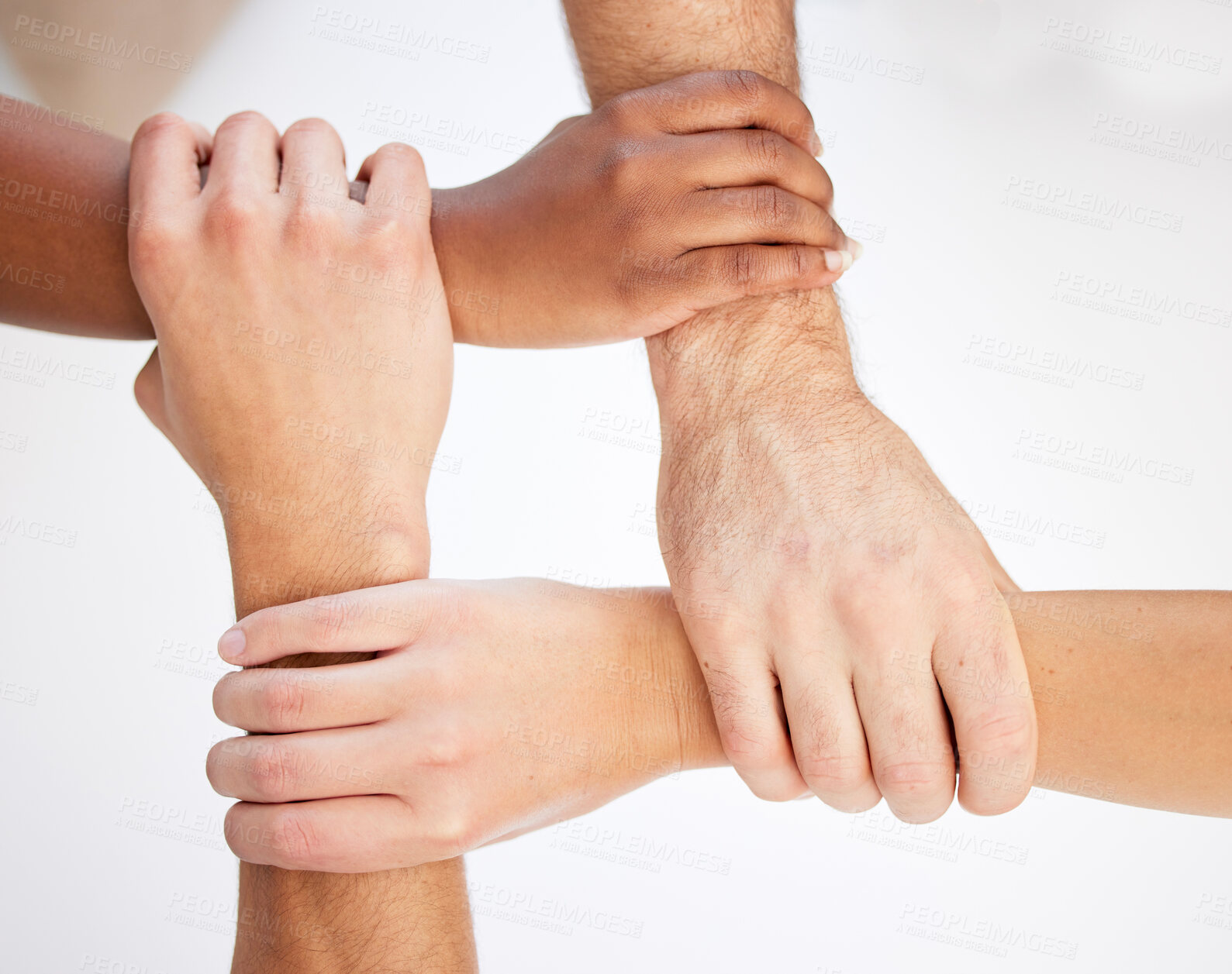 Buy stock photo Cropped shot of a group of unrecognizable businesspeople linking arms