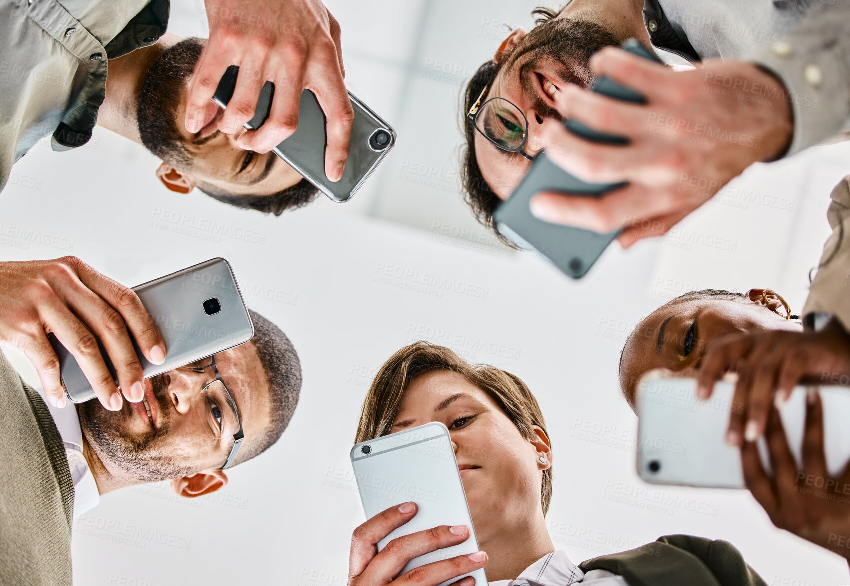 Buy stock photo Teamwork, hand and smartphone together in studio, diversity and solidarity or business people or corporate employees. Below, celebration for target goal or support, inclusion and united in work