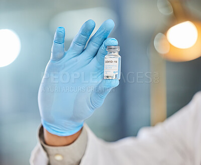 Buy stock photo Cropped shot of a medical practitioner holding a vaccine tube