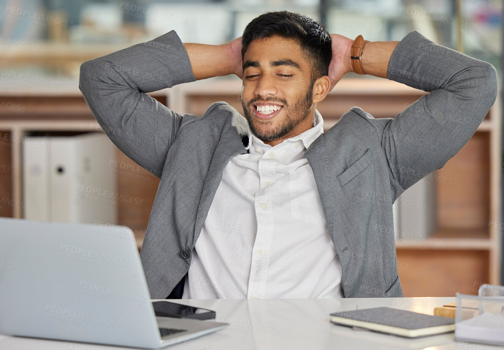 Buy stock photo Finish, relax or happy businessman on break in office for task achievement, good news or success. End, laptop or financial advisor with smile in workplace for resting, calm freedom or stretching arms