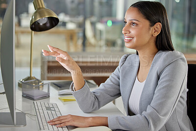 Buy stock photo Shot of a young businesswoman using a computer in a modern office