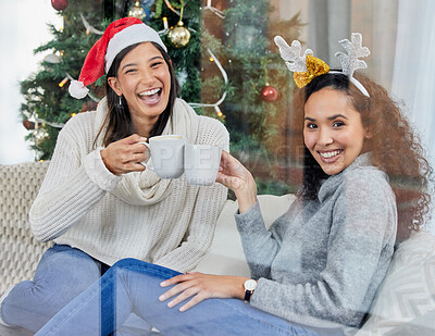 Buy stock photo Shot of two young women drinking coffee at home