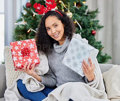 Buy stock photo Woman, portrait and Christmas present in home for festive season gift giving, holiday or living room. Female person, face and smile on couch or package giveaway for winter break, celebration or tree