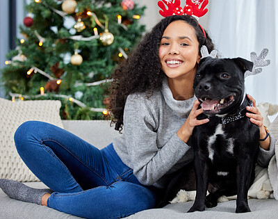 Buy stock photo Woman, portrait and dog for Christmas holiday in home for cozy festive season, bonding or animal. Female person, pet and staffie bull terrier with antler ears for winter break, apartment or relax