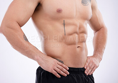 Buy stock photo Shot of a male athlete posing against a grey studio background