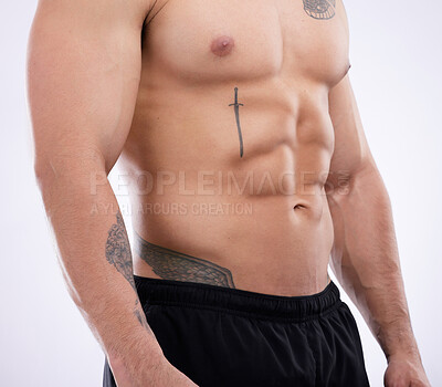 Buy stock photo Shot of a male athlete posing against a grey studio background