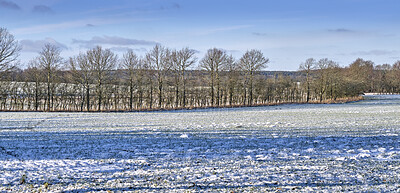 Buy stock photo A photo of a winter landscape at sunset