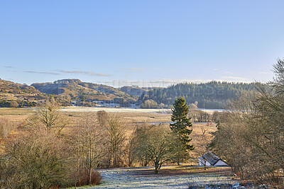 Buy stock photo A photo of a winter landscape at sunset