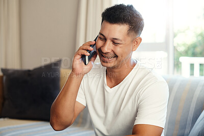 Buy stock photo Happy, man and talking with phone at house couch to relax, communication and contact on break by networking. Smile, male person and mobile discussion, laughing and funny joke in living room sofa