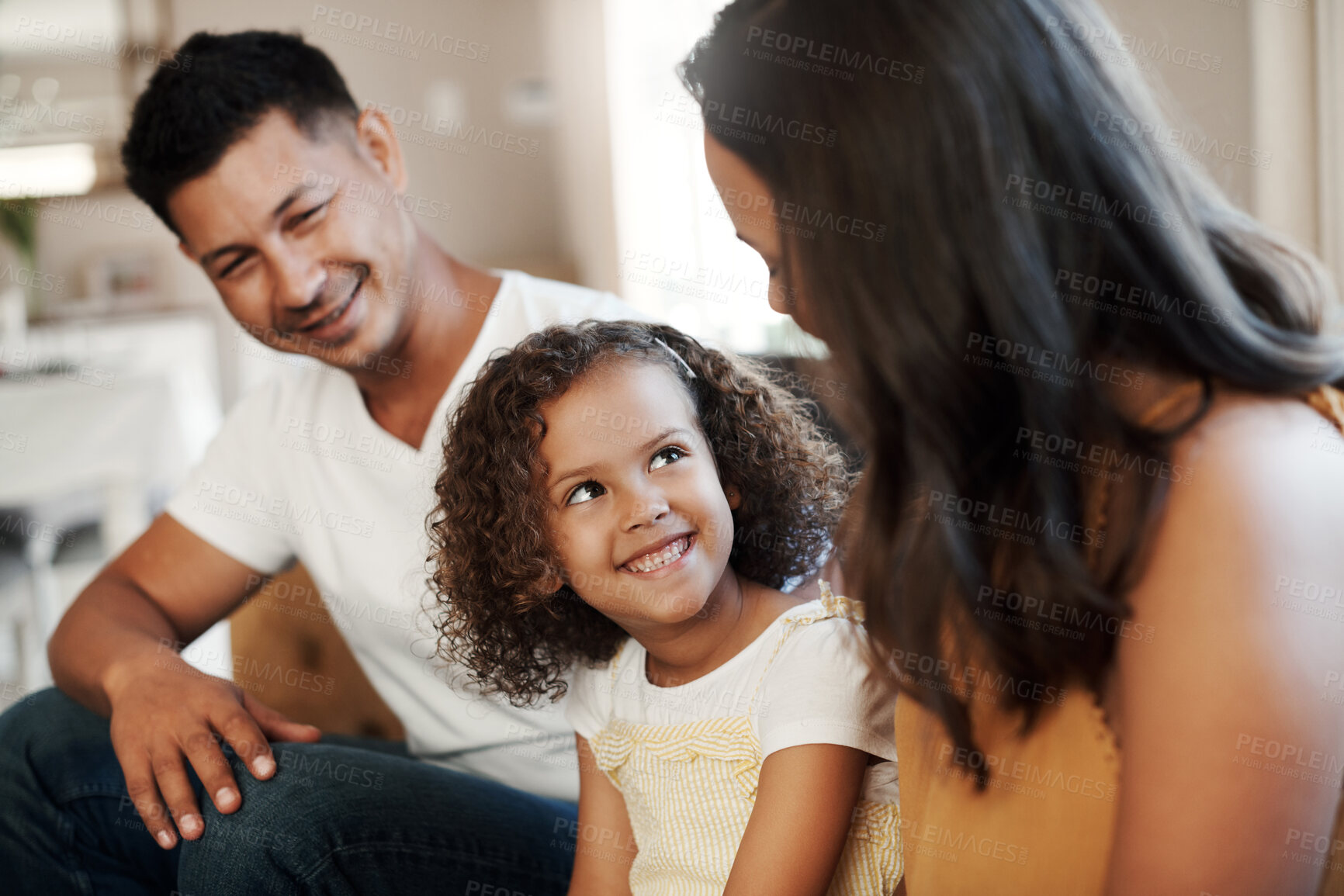 Buy stock photo Mother, father and girl with smile on sofa for family love, bonding and affection with security or safety. Mom, dad and kid relax in living room of home with care, together and weekend with parents.