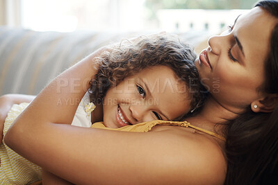 Buy stock photo Portrait of child, hug and mom on couch for love, care and support or relax in morning. Family, mother and girl on sofa for embrace, together and trust or smile for comfort in living room or home