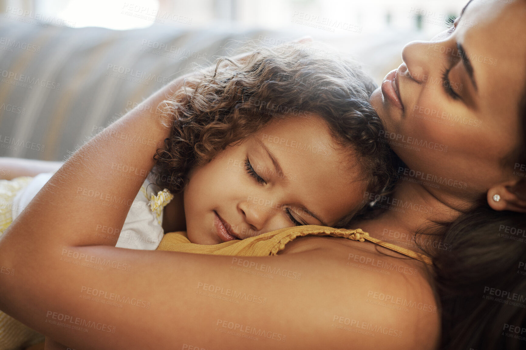 Buy stock photo Mother, girl and sleeping hug on sofa in home, love and support child for security in living room. Mama, daughter and tired family nap on couch, relax and embrace for bonding together or dreaming