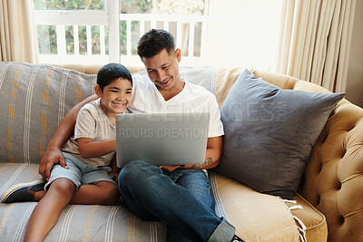 Buy stock photo Dad, boy and hug with laptop on sofa for streaming cartoon movies, entertainment videos and bonding. Father, child and relax in living room of home with technology for online gaming and happiness.