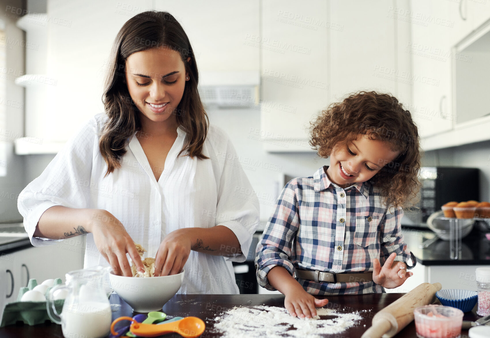 Buy stock photo Kitchen, mother and girl with flour for baking, mixing and preparation on table at family home. People, mom baker and happy child for learning, helping and skills development with dough for pastry