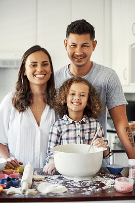 Buy stock photo Portrait of an adorable little girl baking with her parents at home