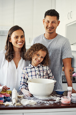 Buy stock photo Portrait of an adorable little her baking with her parents at home