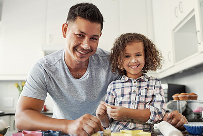 Buy stock photo Portrait of a sweet little girl baking with her father at home in the kitchen