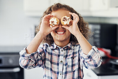 Buy stock photo Shot of a playful little girl having fun while baking in the kitchen at home