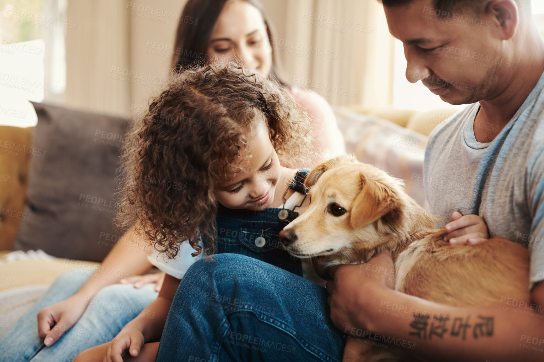 Buy stock photo Mom, dad and kid on sofa with puppy, love and morning bonding together in living room of family home. Parents, happy girl and dog relax on couch with pet care, touch and child development with trust