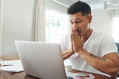Buy stock photo Cropped shot of a handsome young man looking stressed while working on a laptop in the living room at home