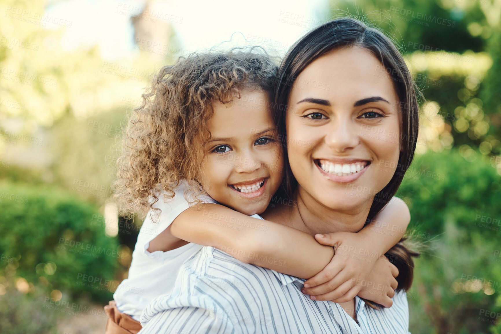 Buy stock photo Shot of a young woman giving her daughter a piggyback ride