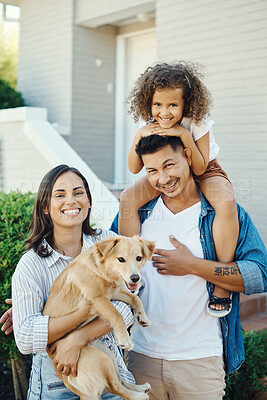 Buy stock photo Shot of a young family spending time together with their dog