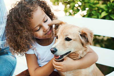 Buy stock photo Shot of a little girl spending time with her pet dog