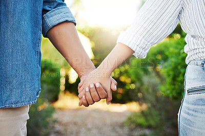 Buy stock photo People, holding hands and outdoor with zoom for date with romance, bonding together in backyard for relationship.  Couple, palms together and walk in backyard with partner for love, trust or support