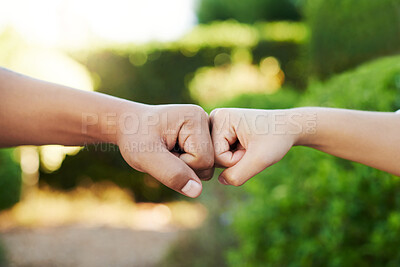 Buy stock photo Cropped shot of an unrecognizable couple fist bumping in their yard at home
