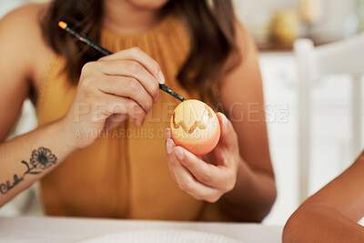 Buy stock photo Shot of a woman painting an easter egg