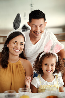 Buy stock photo Shot of a young family spending time together during easter