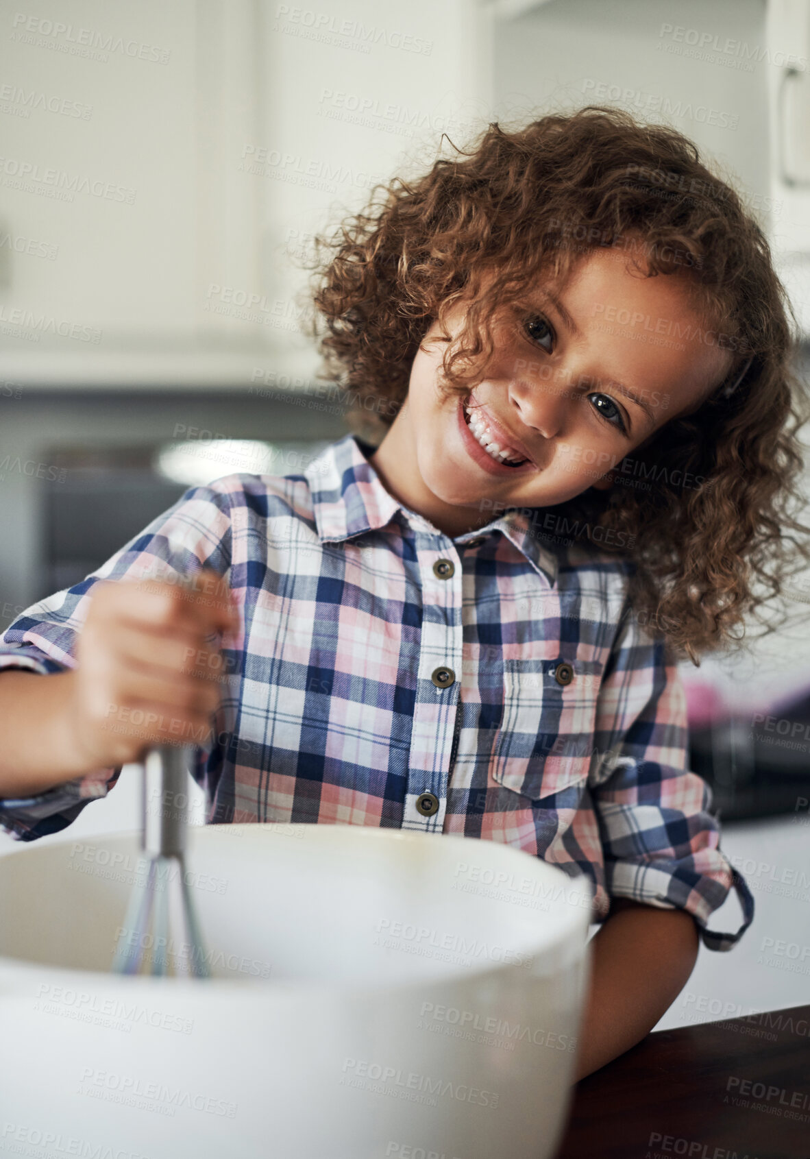Buy stock photo Portrait of a playful little girl having fun while baking in the kitchen at home