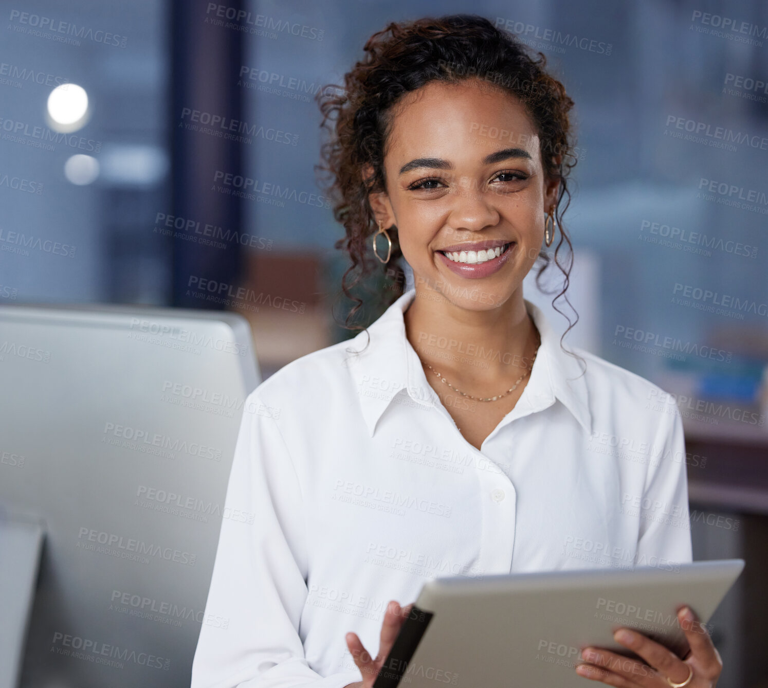 Buy stock photo Shot of a young businesswoman using a digital tablet at work