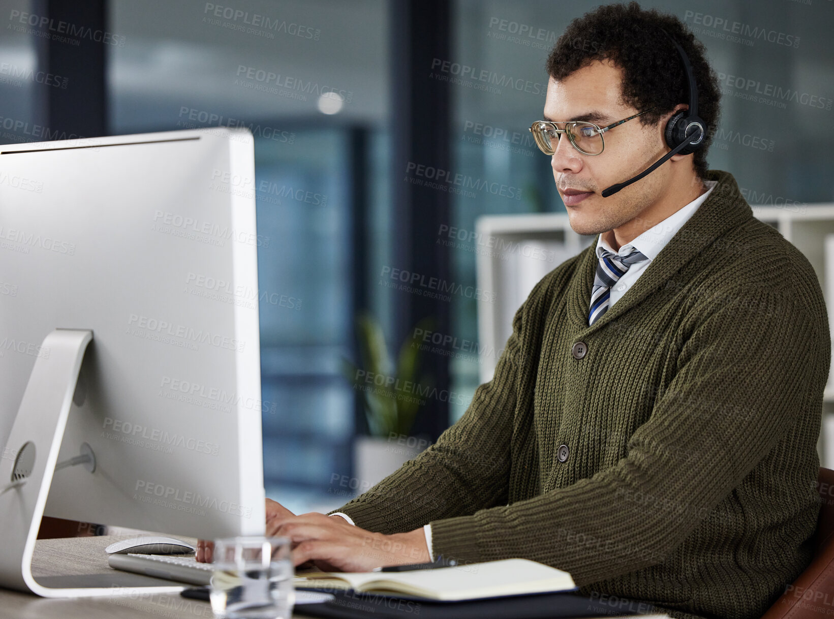 Buy stock photo Man, typing and computer with headset in office for call center, customer with problem in Ukraine. Male consultant, keyboard and help with headphones in workplace, subscription or deal for internet