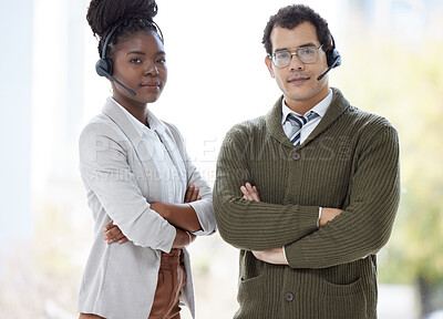 Buy stock photo Portrait of two call centre agents standing together with their arms crossed in an office