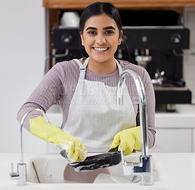 Buy stock photo Smile, portrait and woman washing dishes in home for cleaning, hygiene and housework in kitchen. Face, soap and sponge on pan with foam for dirt, safety or maid with chores for housekeeping in Brazil