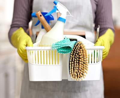 Buy stock photo Shot of an unrecognizable person holding a bucket with cleaning supplies at home