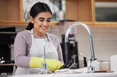 Buy stock photo Happy, woman and washing dishes in home for cleaning, hygiene and routine housework in kitchen. Water, soap and sponge on pan with foam for dirt, safety and maid with chores for housekeeping service
