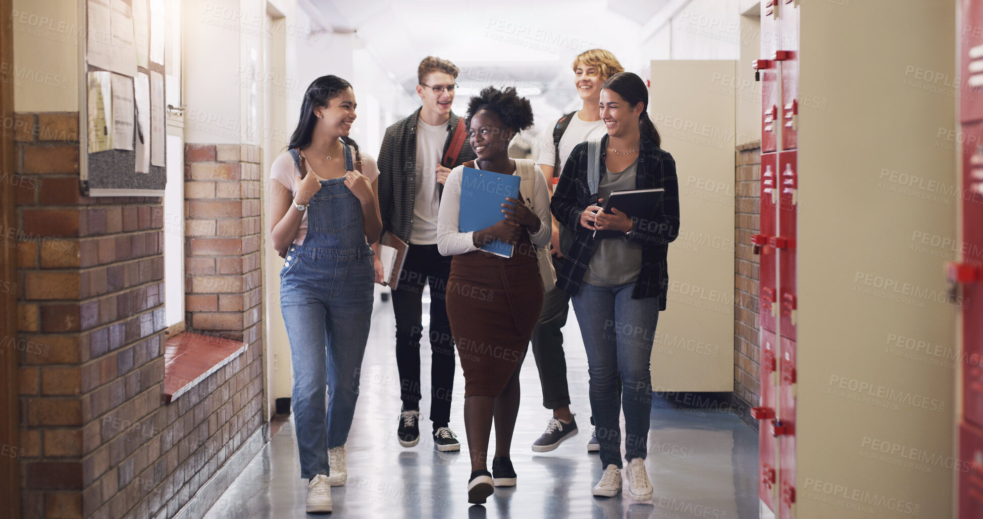 Buy stock photo Happy, school diversity and students in a hallway for education, learning and talking. Smile, conversation and friends speaking while walking to class from a break and studying together as a group