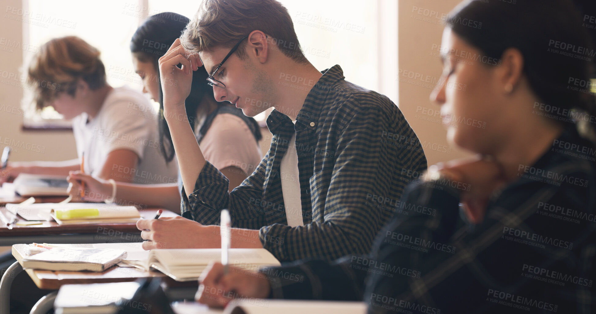 Buy stock photo High school, students and writing exam at desk in classroom for learning education, academic or scholarship. Boy, girl and academy campus for future development with lesson, assessment or studying