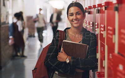 Buy stock photo Portrait, education and notebook break with a girl by her locker in the hallway of her school. Learning, university or scholarship with a college pupil holding research books for studying knowledge