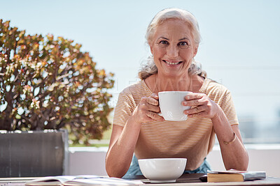 Buy stock photo Portrait of a mature woman having coffee with her breakfast on the balcony at home