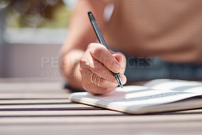 Buy stock photo Hand, journal and book with a woman writer sitting outdoor in summer for inspiration as an author. Idea, planning and notebook with a female person using a pen to write in a planner or diary outside