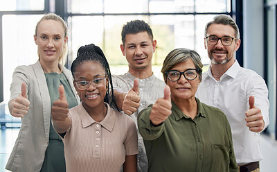 Buy stock photo Shot of a diverse group of businesspeople giving the thumbs up