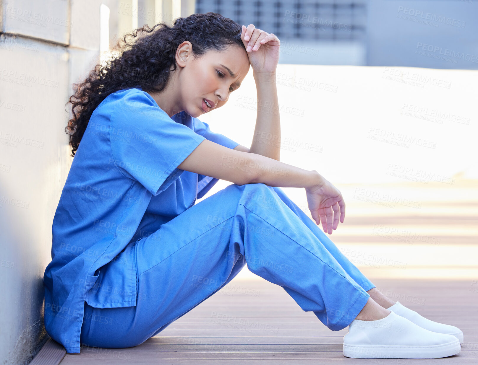 Buy stock photo Outside, female nurse and stress, tired and mental health of medical employee outdoor. Exhausted, healthcare worker or woman with migraine or burnout, anxiety and overworked pressure in balcony