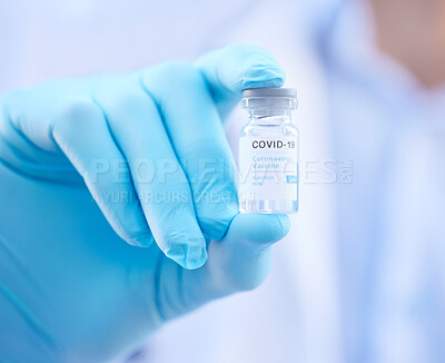 Buy stock photo Cropped shot of an unrecognizable doctor holding a corona virus vaccine outside