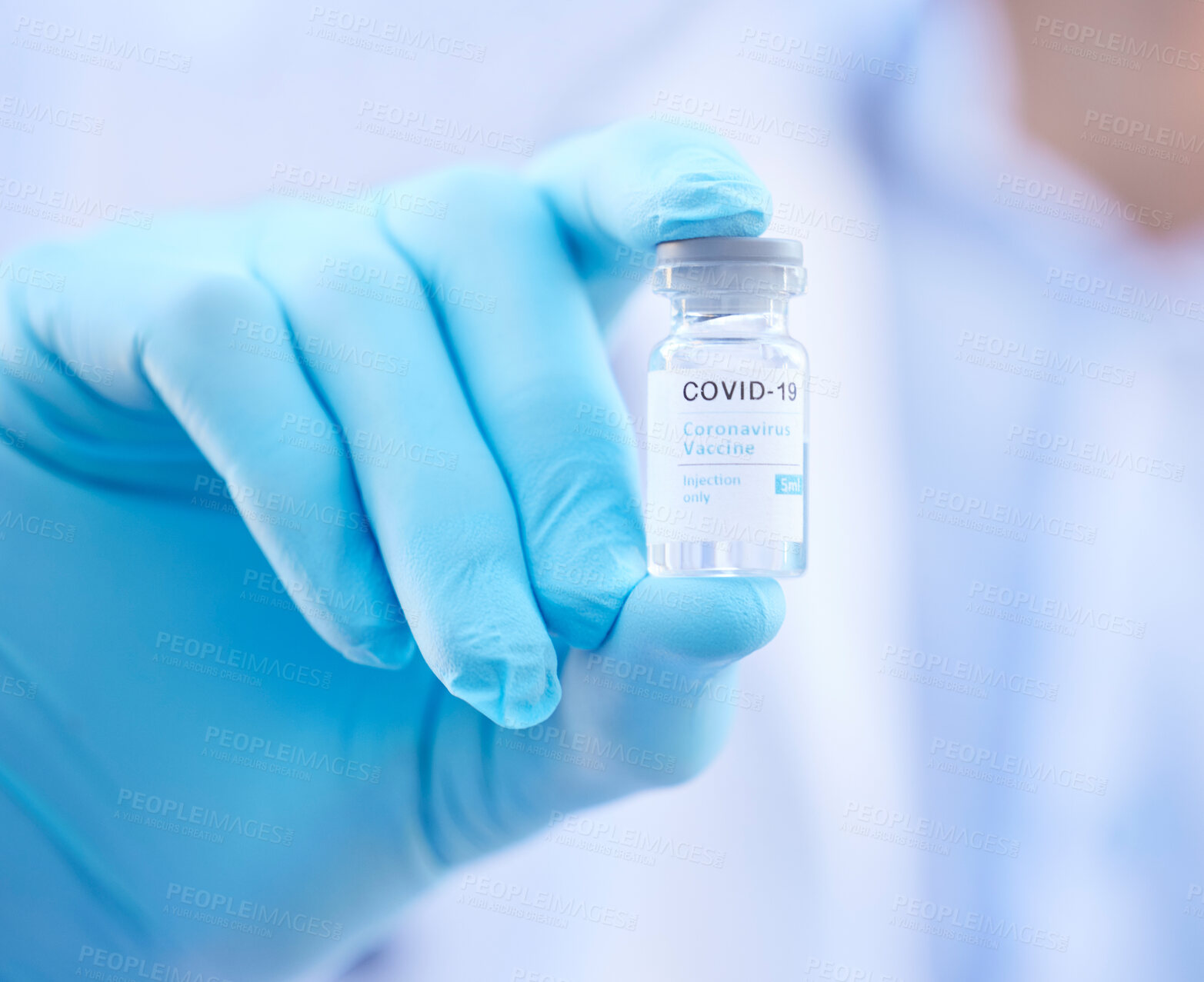 Buy stock photo Cropped shot of an unrecognizable doctor holding a corona virus vaccine outside