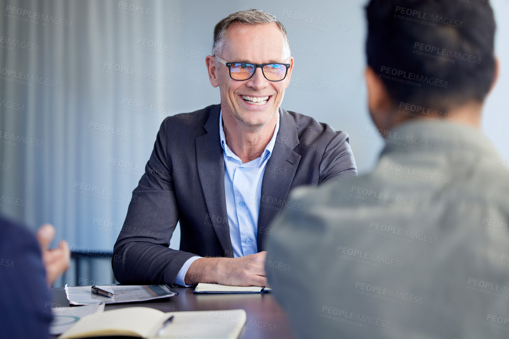 Buy stock photo Shot of two businessmen having a meeting in an office